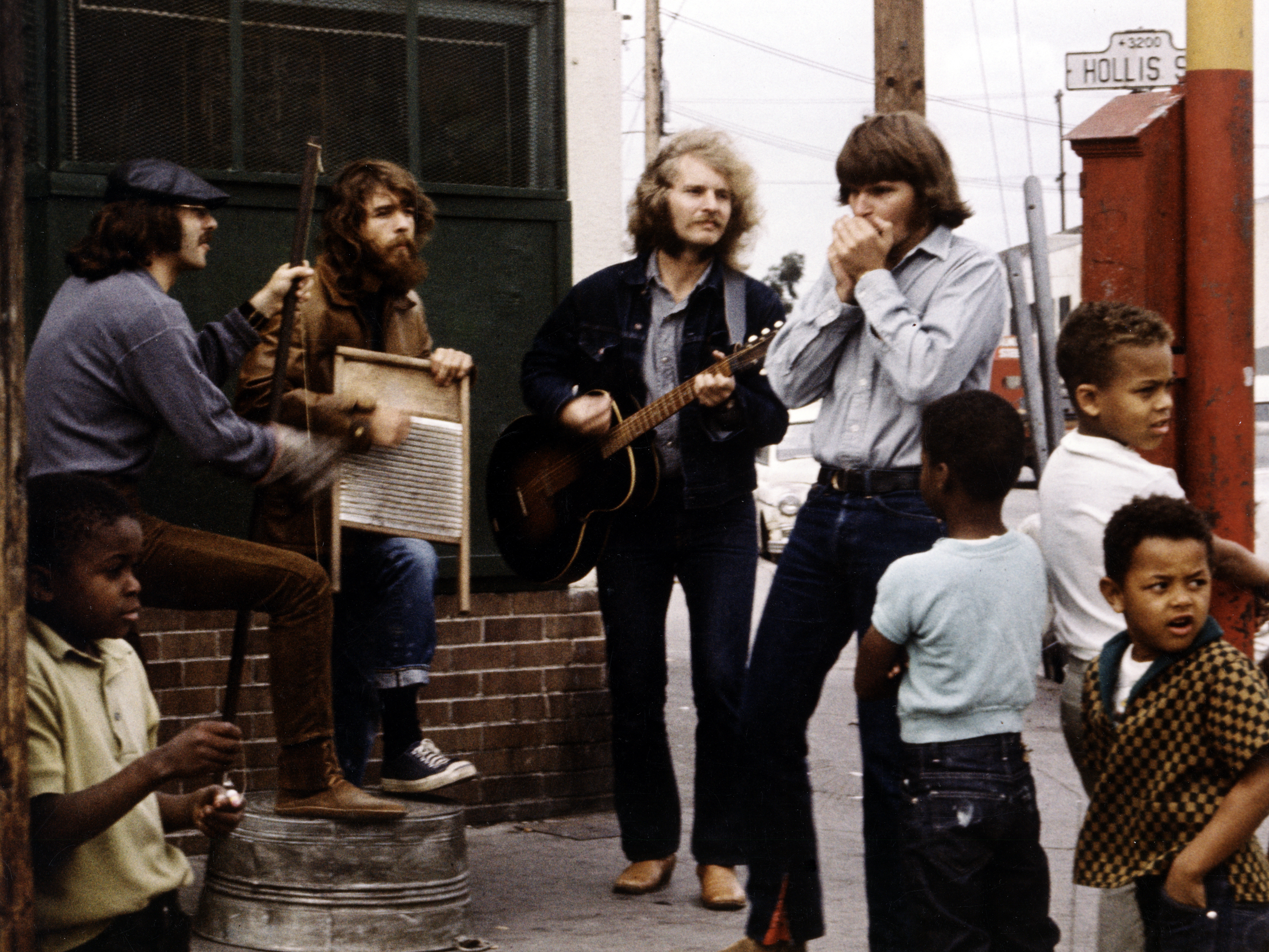 The members of Creedence Clearwater Revival during a street