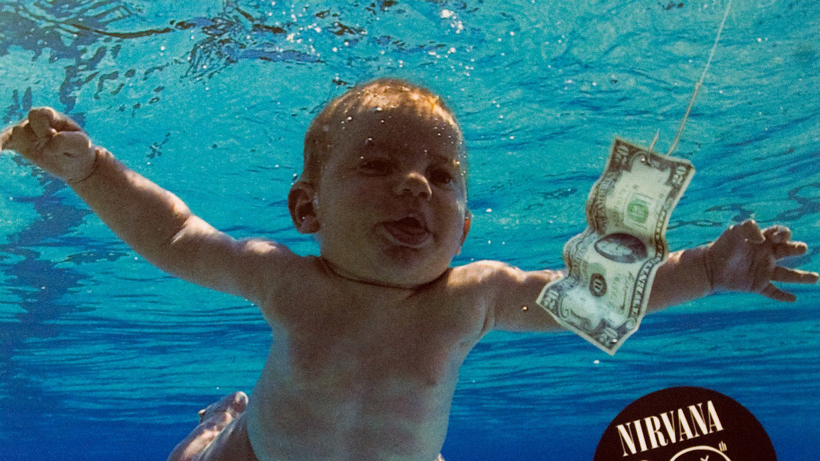 Featured image for “Man Photographed As A Baby On ‘Nevermind’ Cover Sues Nirvana For Sexual Exploitation”