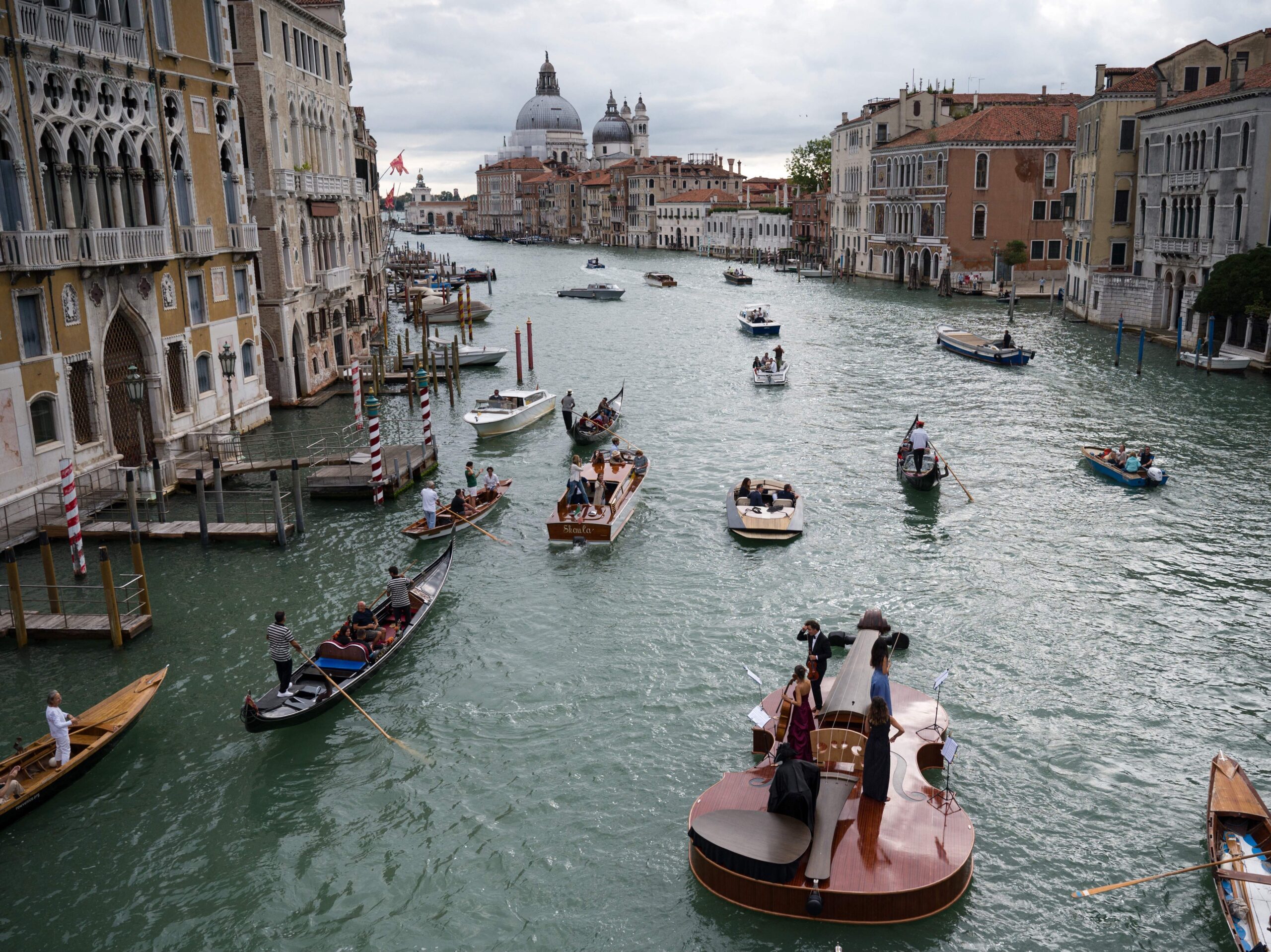 Featured image for “Watch A Massive Violin Transport Musicians Down Venice’s Grand Canal”